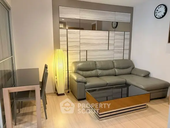 Modern living room with stylish sofa and sleek coffee table in a cozy apartment setting.
