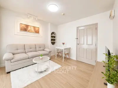 Bright and cozy living room with modern decor and wooden flooring