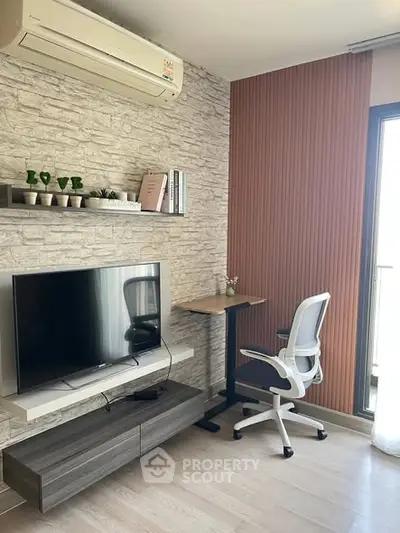 Modern living room with stylish TV setup and ergonomic workspace