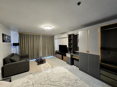 Spacious modern living room with elegant decor and ample natural light