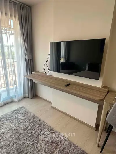 Modern living room with wall-mounted TV and elegant decor