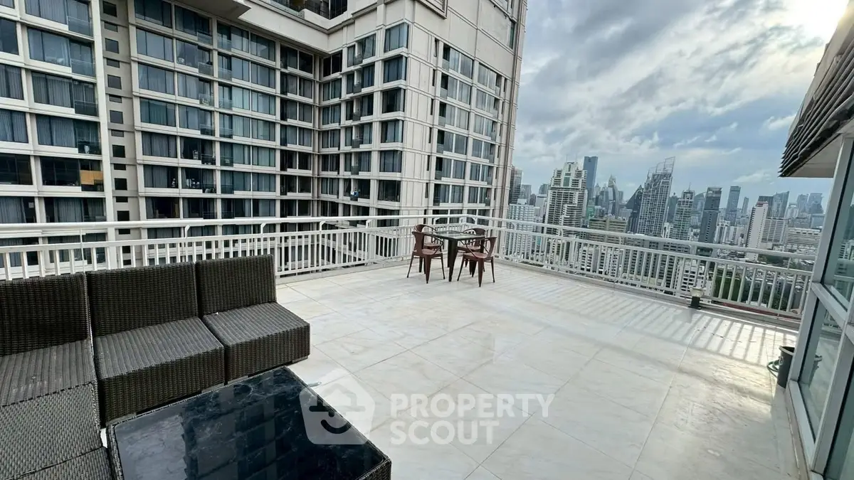 Spacious rooftop terrace with stunning city skyline views, perfect for outdoor relaxation and entertainment.