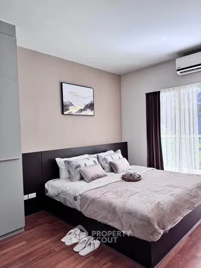 Modern bedroom with stylish decor and natural light