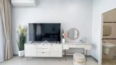 Modern living room with stylish TV console and elegant decor