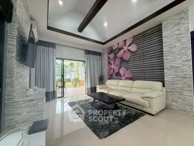 Luxurious living room with modern decor and large windows overlooking garden