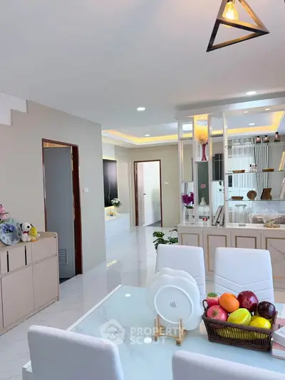 Modern open-plan living and dining area with stylish decor and natural light