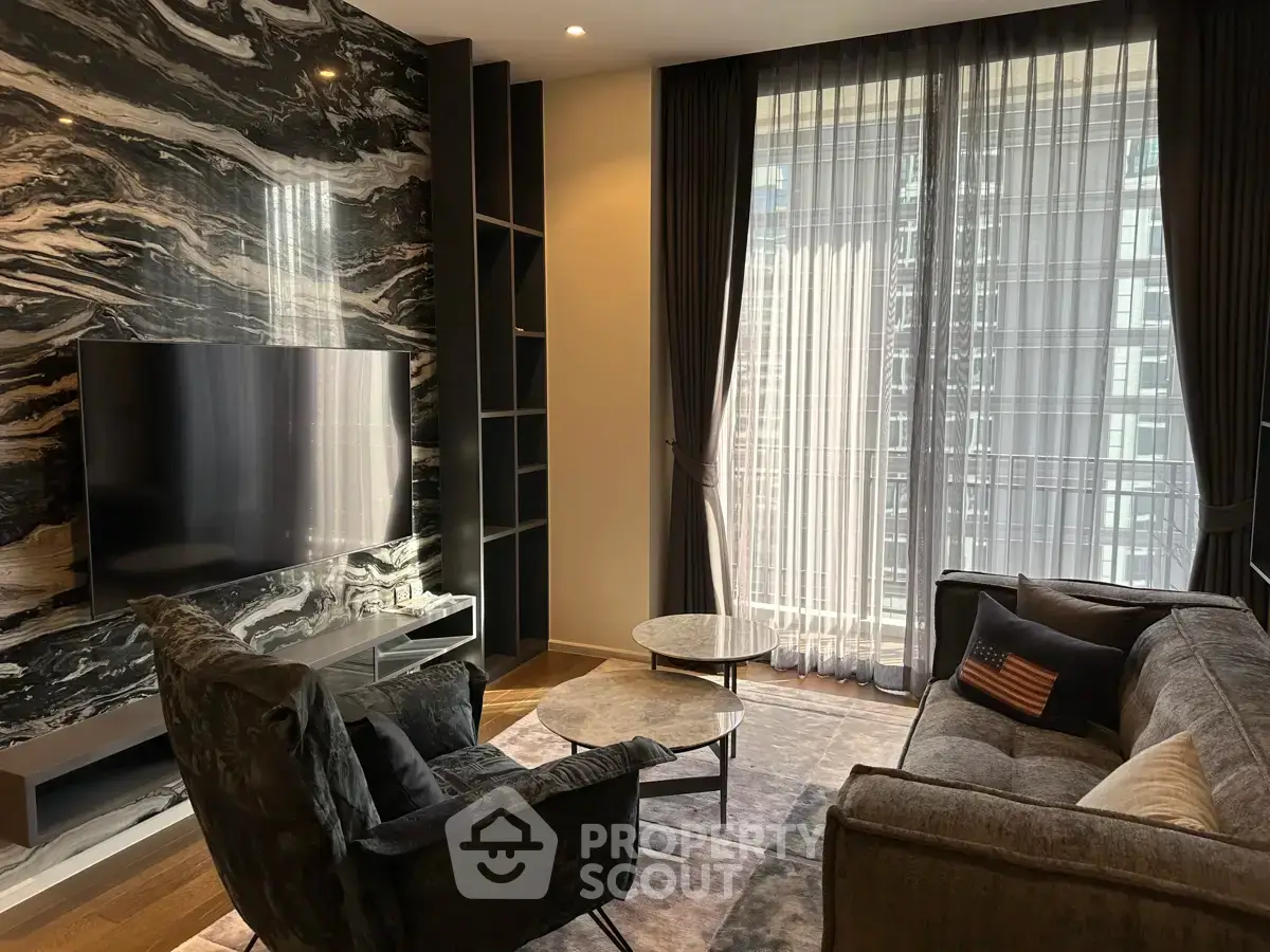 Luxurious living room with modern decor and large window view in upscale apartment.