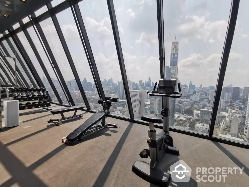 Luxury gym with panoramic city view and modern fitness equipment