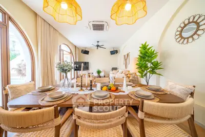 Luxurious open-plan living and dining area with elegant decor and natural light.