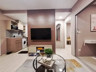 Modern living room with open kitchen and stylish decor