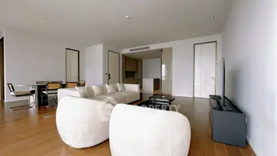 Spacious modern living room with elegant furniture and open kitchen layout