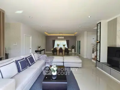 Spacious modern living room with elegant dining area and stylish decor