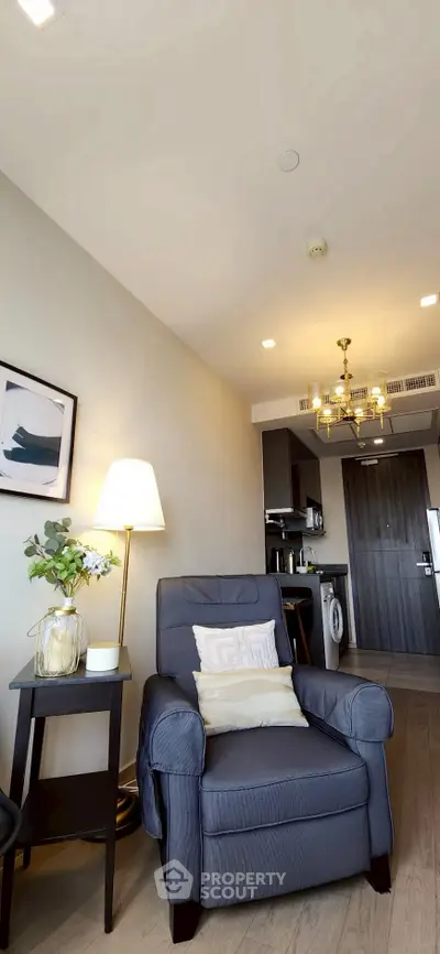 Cozy living room with elegant armchair and modern decor in a stylish apartment.