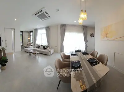 Spacious modern living and dining area with elegant decor and natural light