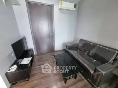 Modern living room with sleek furniture and air conditioning, perfect for cozy urban living.