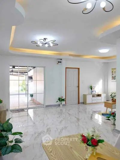 Spacious modern living room with elegant lighting and marble flooring