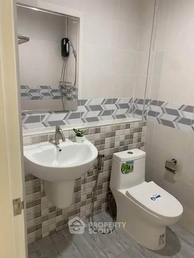 Modern bathroom with stylish tiles and sleek fixtures, perfect for contemporary living.