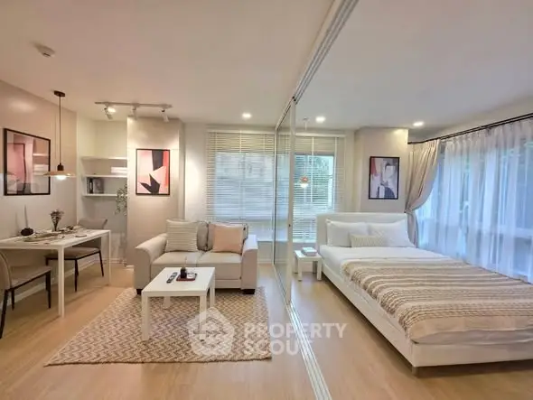 Modern open-plan studio apartment with stylish decor and natural light