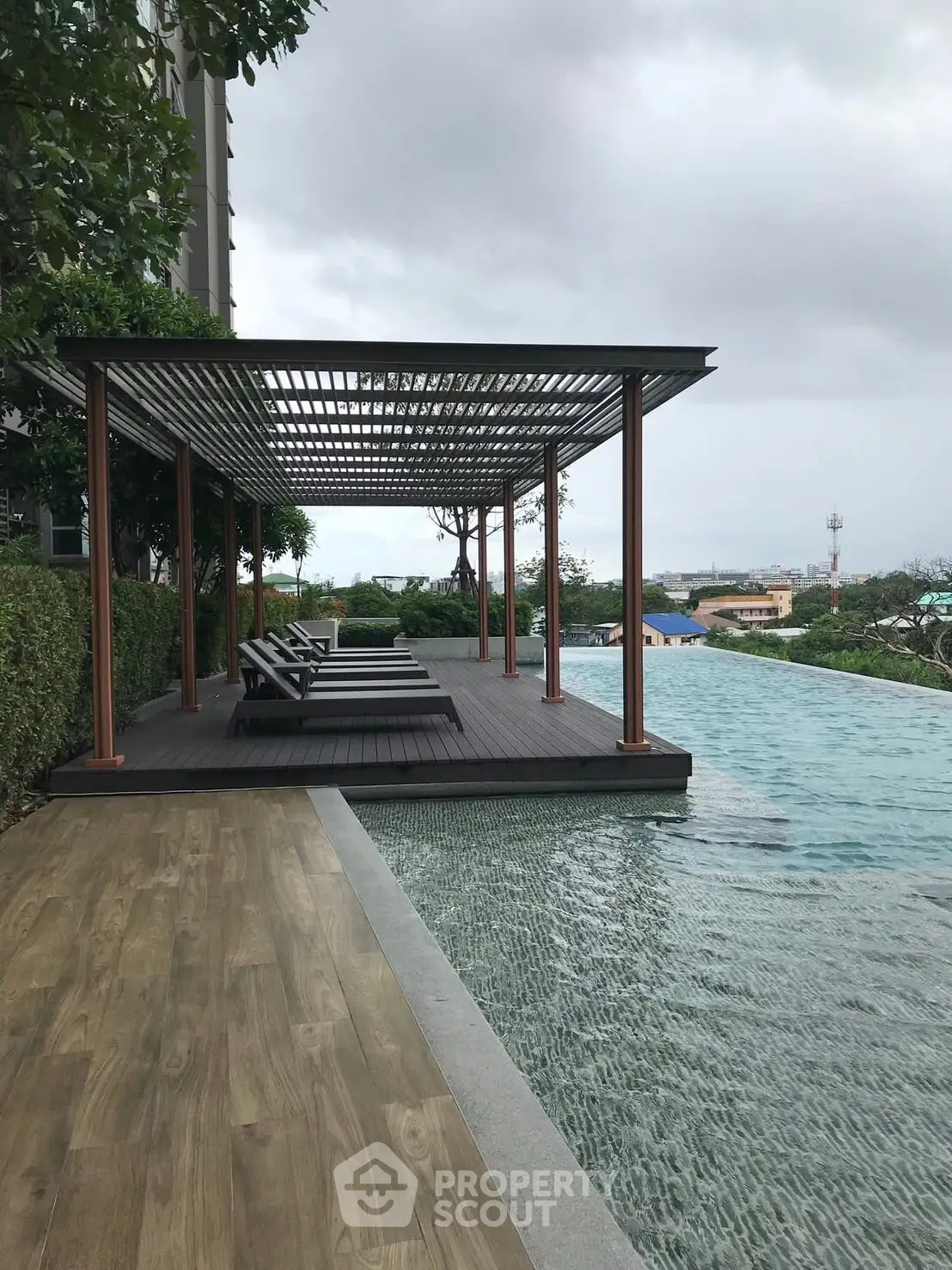 Luxurious rooftop pool with stylish lounge area and stunning city views.
