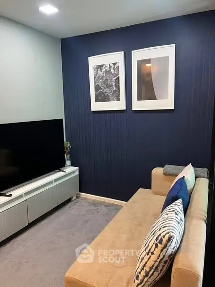 Cozy living room with modern decor and stylish blue accent wall