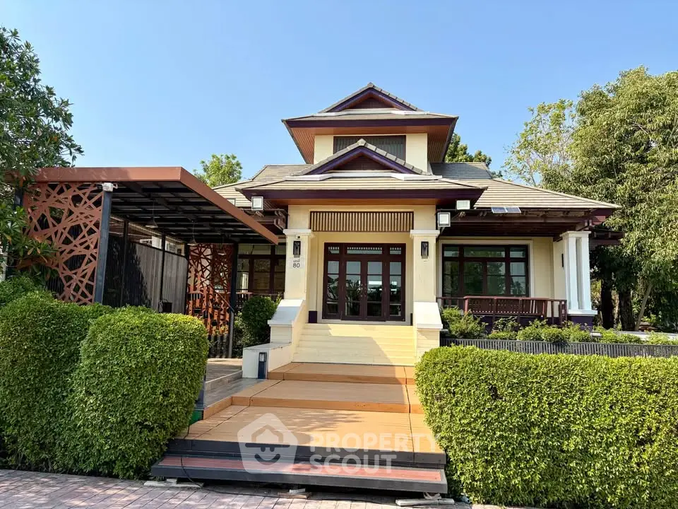 Charming single-story house with lush greenery and modern architectural design.