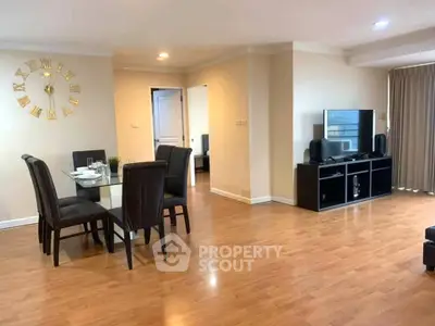 Spacious living room with dining area and modern decor, perfect for entertaining guests.