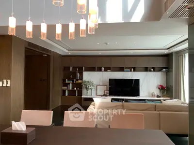 Luxurious modern living room with elegant lighting and stylish wooden cabinetry