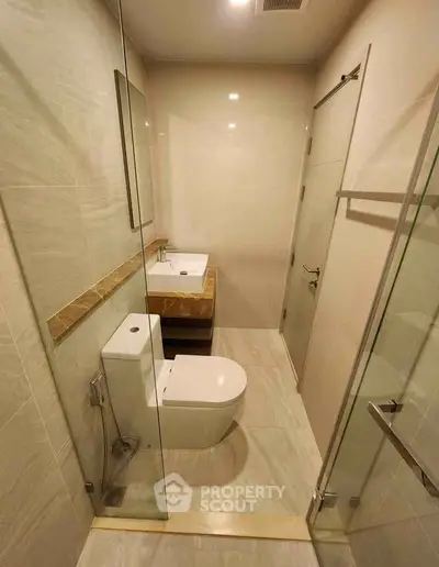 Modern bathroom with sleek design and glass shower enclosure