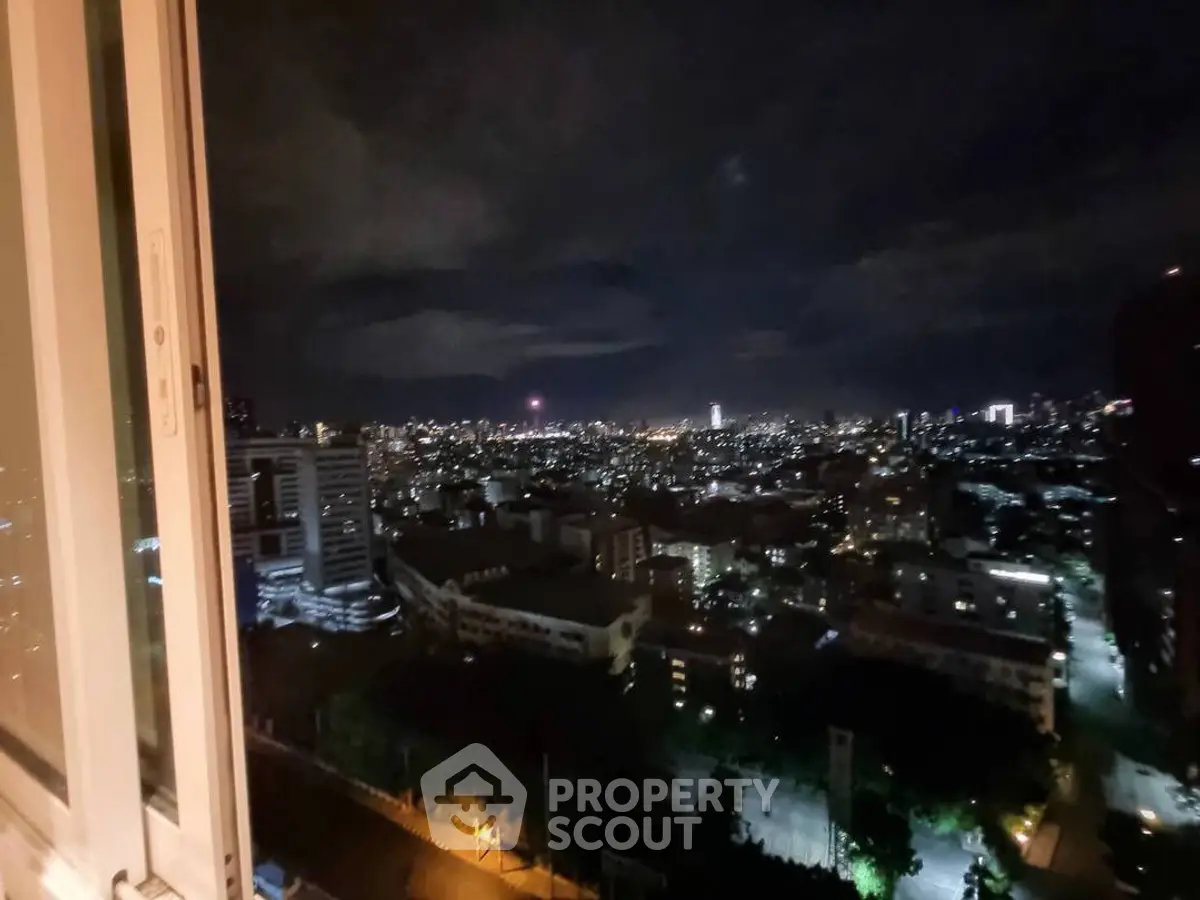 Stunning cityscape night view from high-rise apartment window
