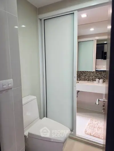 Modern bathroom with sleek design and sliding door
