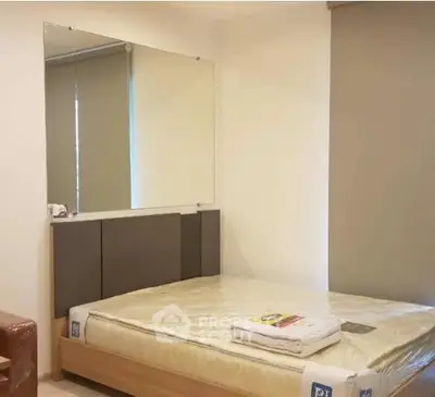 Cozy bedroom with modern minimalist design and large mirror