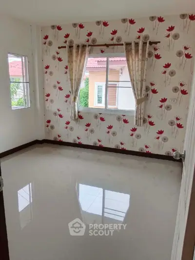 Bright empty room with floral wallpaper and glossy floor tiles
