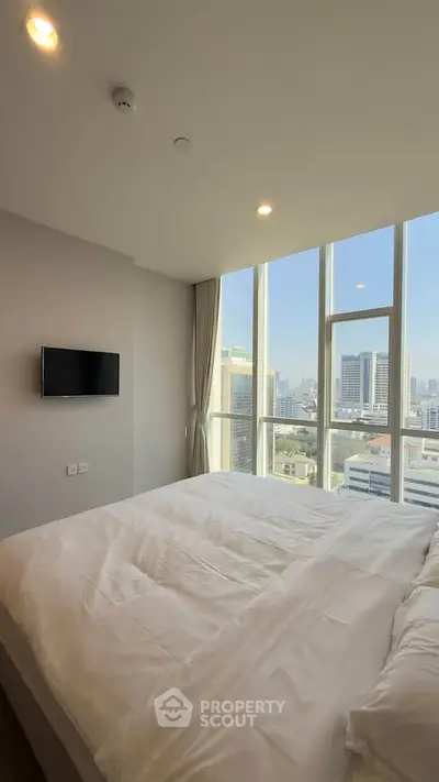 Luxurious bedroom with stunning city view and modern amenities