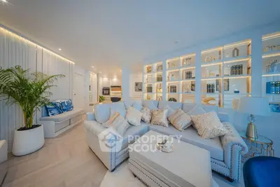 Luxurious living room with elegant decor and built-in shelving, perfect for modern living.