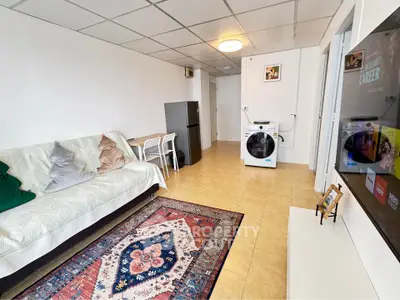 Cozy living room with washing machine and modern decor