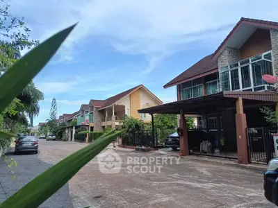 Charming suburban street with modern houses and lush greenery, perfect for family living.