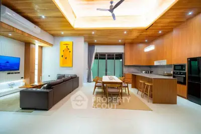 Luxurious open-plan living room with modern kitchen and stylish decor