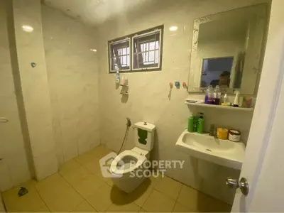 Spacious bathroom with modern fixtures and ample natural light