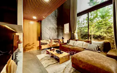 Luxurious living room with large windows and modern decor