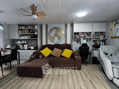 Modern living room with brown sectional sofa and world map wall art