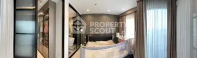 Spacious bedroom with modern design and large windows offering natural light.