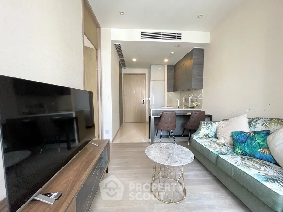 Modern living room with stylish decor and open kitchen layout