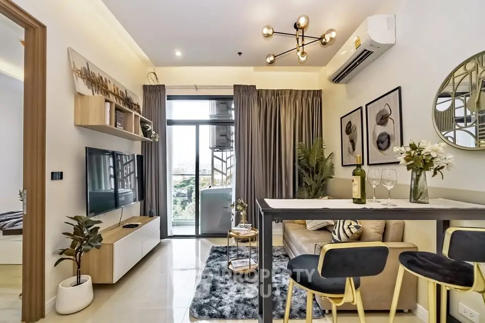 Modern living room with stylish decor, open layout, and balcony view in a contemporary apartment.