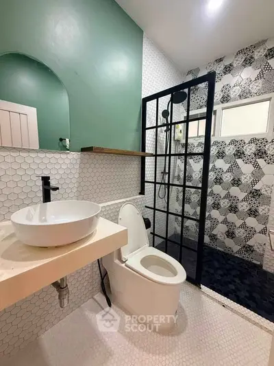 Modern bathroom with stylish shower and sleek fixtures in contemporary design.