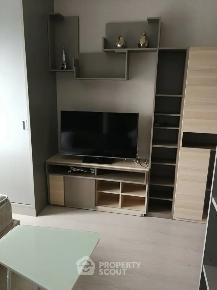 Modern living room with sleek TV unit and stylish shelving