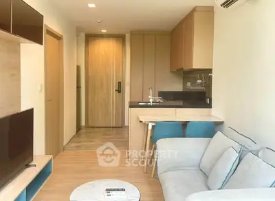 Modern apartment interior with cozy living room and compact kitchen, featuring stylish furniture and wooden accents.