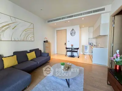 Modern living room with stylish decor and open kitchen layout, perfect for urban living.