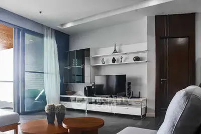 Modern living room with sleek furniture and entertainment center