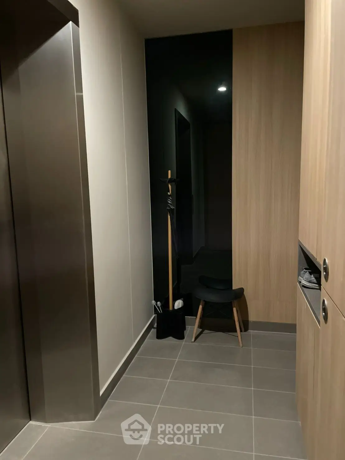 Modern apartment hallway with elevator and stylish decor