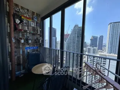 Chic urban balcony with stunning city skyline view, perfect for relaxation and enjoying the vibrant city life.